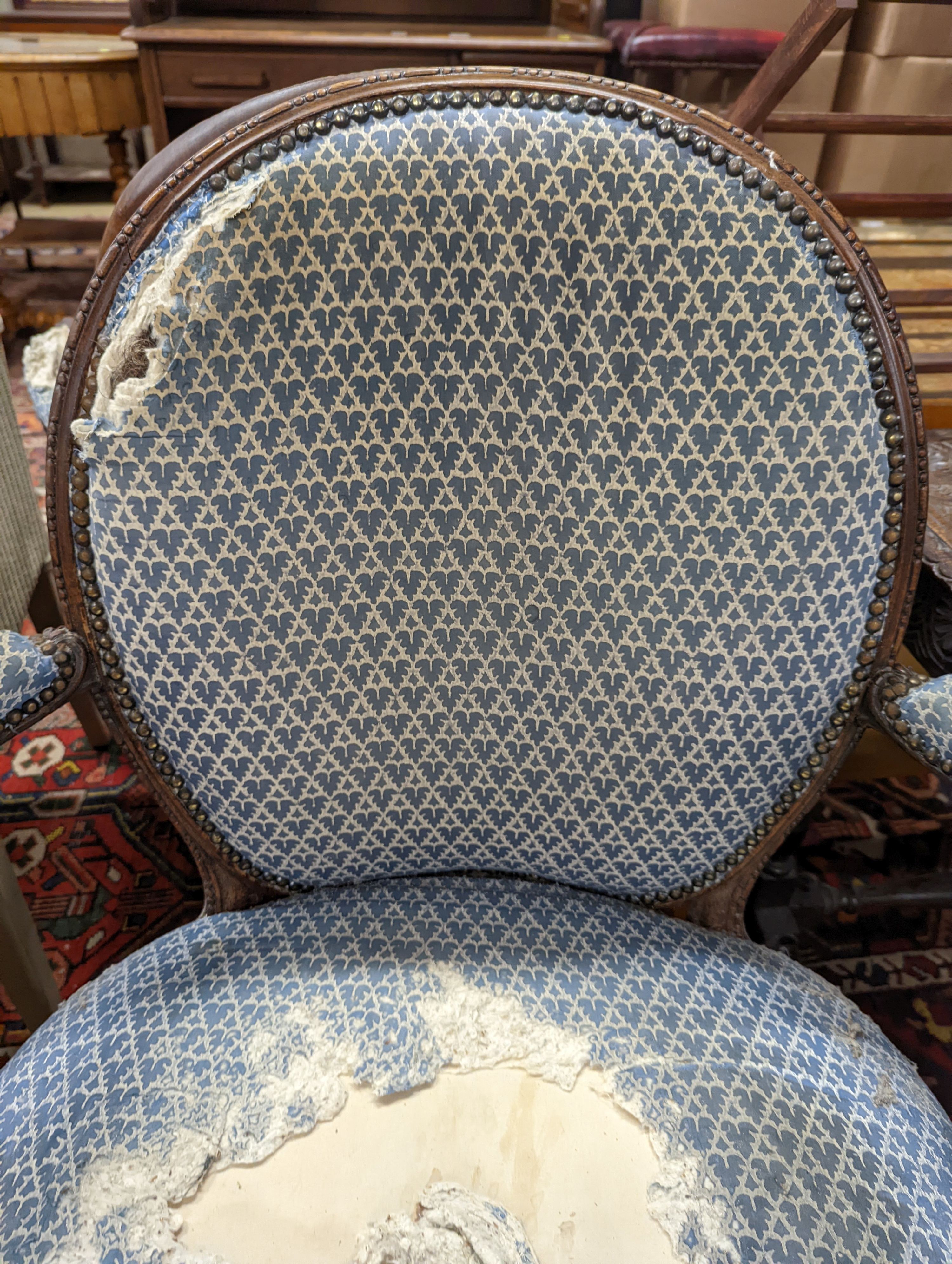 A pair of George III Hepplewhite style mahogany open armchairs, width 64cm, depth 50cm, height 92cm
